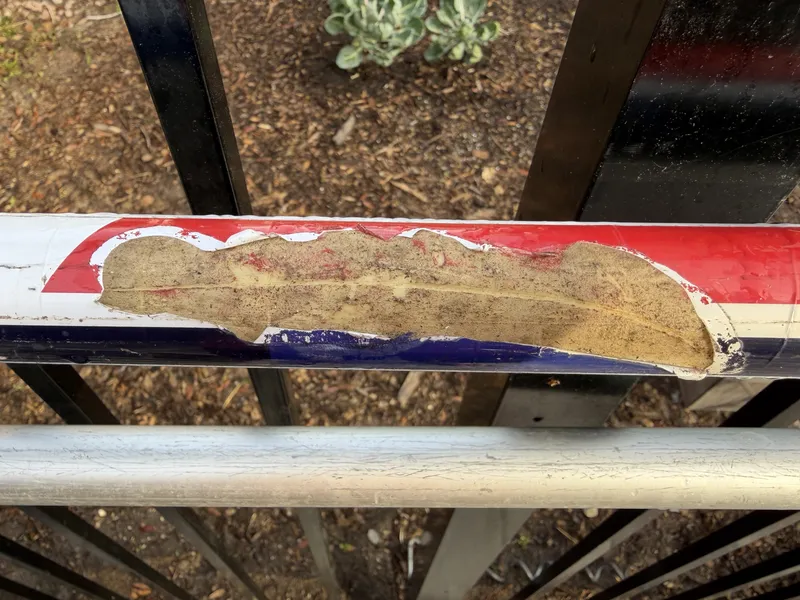 Deep spike mark on a vaulting pole